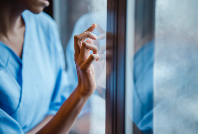 a patient looking through mirror